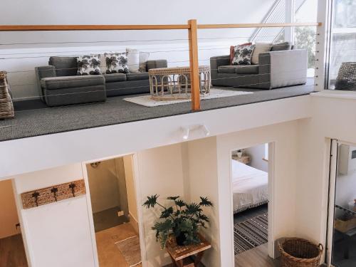 a view of a living room from the top floor of a house at Whitesands in Dunsborough