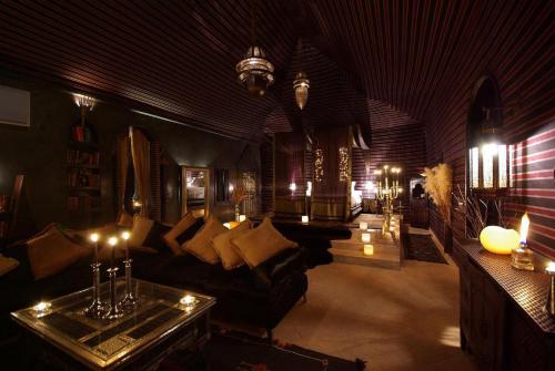 a living room with a couch and a table at Lodge K in Marrakech