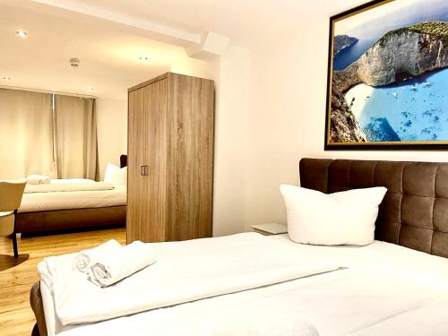 Säng eller sängar i ett rum på Hotel Garni Anker