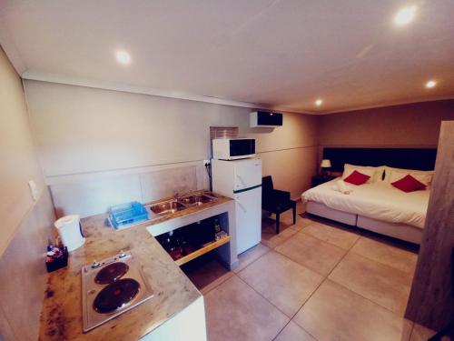 Katil atau katil-katil dalam bilik di Orange River Rafting Lodge