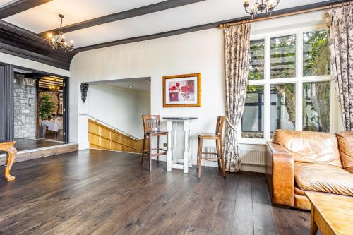 a living room with a couch and a table at Best Western The Webbington Hotel & Spa in Loxton