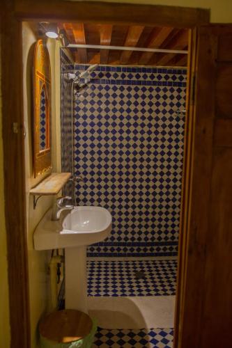 a bathroom with a sink and a shower at Medina social club in Fès