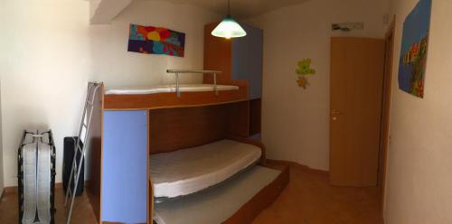 a small room with two bunk beds in it at Porto Cesareo Sant'Isidoro Delizioso Trilo in Sant'Isidoro