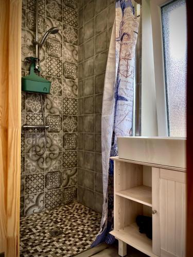 a bathroom with a shower and a sink at Plateliai Samogitia Barn in Plateliai