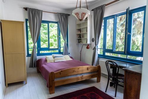 Postel nebo postele na pokoji v ubytování Liget Vendégház