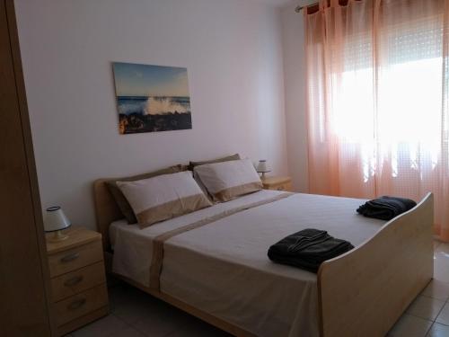 Postel nebo postele na pokoji v ubytování Appartamento Il Ginepro