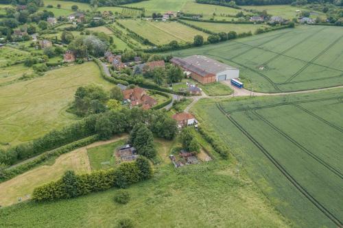 an aerial view of a house in a field at Plum Pudding Stables by Bloom Stays in Faversham