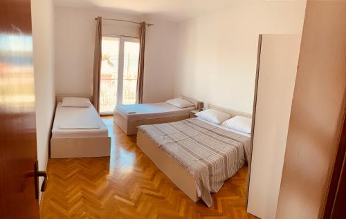 A bed or beds in a room at Bibinje Comfort & Style Apartment 1st floor