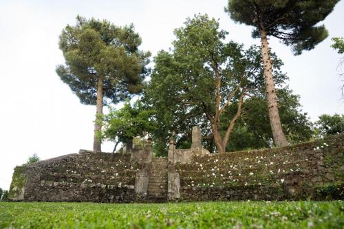 an old cemetery with trees in the background at Santoro Country House in Castiglione di Sicilia