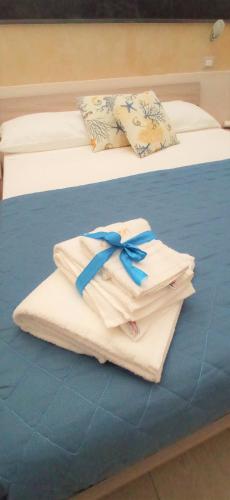 Katil atau katil-katil dalam bilik di Aden B&B Salento