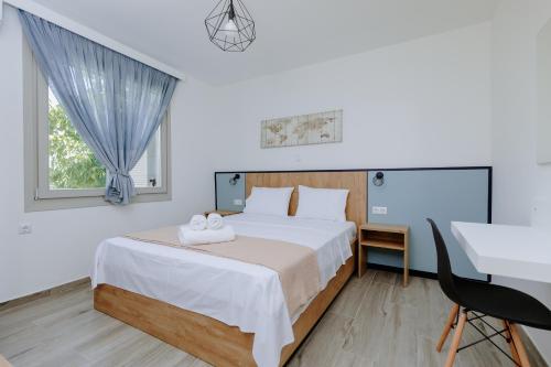 Ένα ή περισσότερα κρεβάτια σε δωμάτιο στο Ilios house