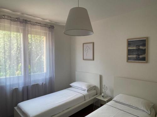 Postel nebo postele na pokoji v ubytování Villa Ajna
