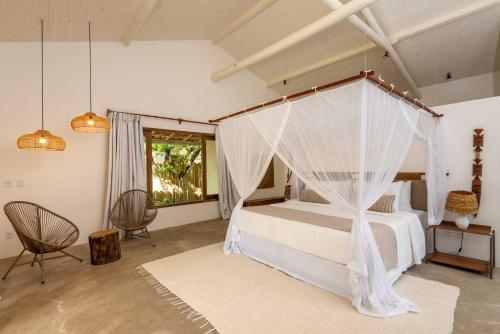 Ένα ή περισσότερα κρεβάτια σε δωμάτιο στο Villa dos Nativos Boutique Hotel