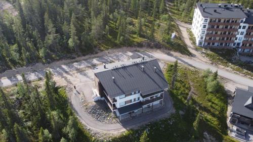 an aerial view of a house with a roof at Villa Ylläs 101 in Ylläsjärvi