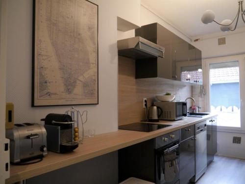 a kitchen with a large map on the wall at Appartement le Flatiron - 4 chambres in Tarbes