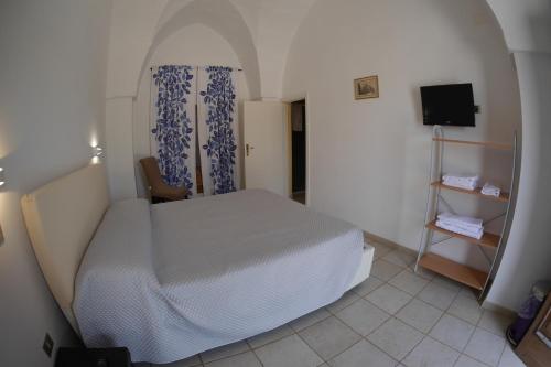 Postel nebo postele na pokoji v ubytování Masseria Lama D'impisa