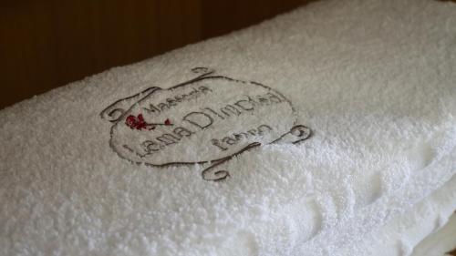 a drawing of a towel with the words on it at Masseria Lama D'impisa in Fasano