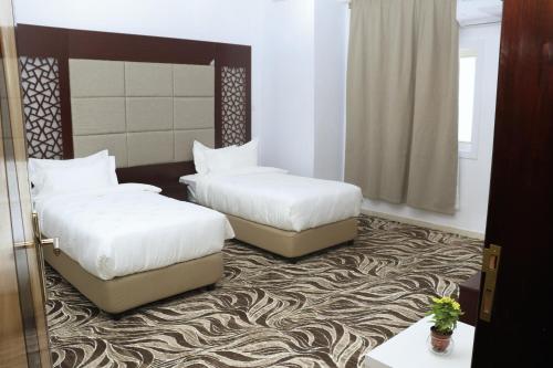 Postel nebo postele na pokoji v ubytování Diafat Alsaadah For Serviced Apartment-Dumat Al Jandal
