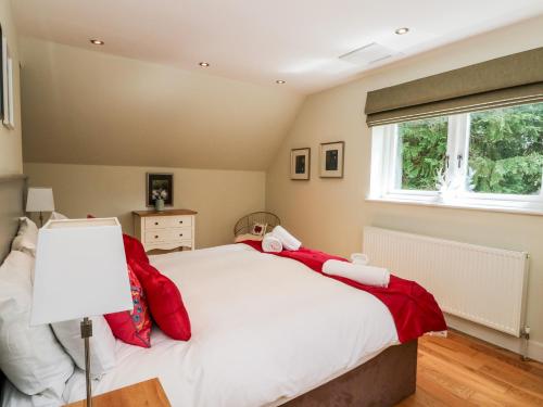 a bedroom with a bed and a window at Waterfall Apartment in Inverness