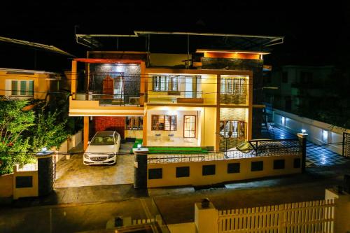 a house with a car in front of it at night at Belljem Homes -your own private resort -3 BHK FF in Trichūr