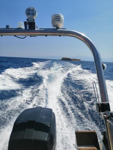 a view of the front of a boat in the water at Luxury seafront house nearby Delphi in Kírra