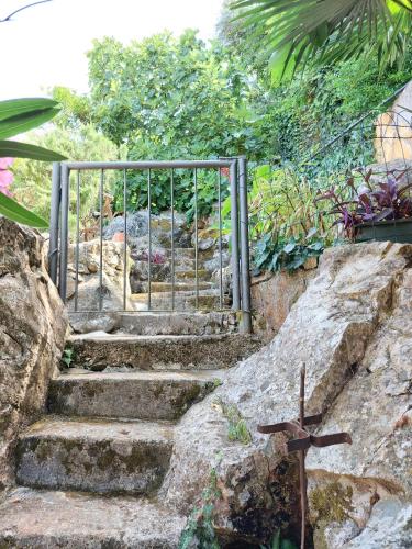 a metal gate on a set of stairs at Villa Riva in Molunat