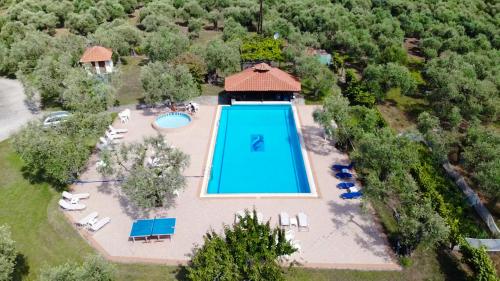 an overhead view of a swimming pool in a resort at Hotel Coral in Skala Rachoniou