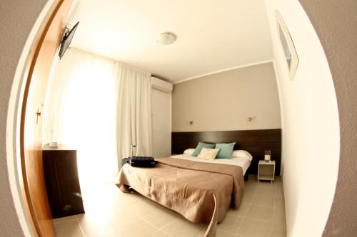 Voodi või voodid majutusasutuse Hostal Tahiti RS toas