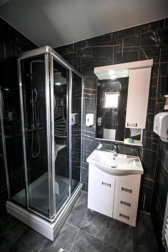 a bathroom with a shower and a sink at Respect034 in Arandjelovac