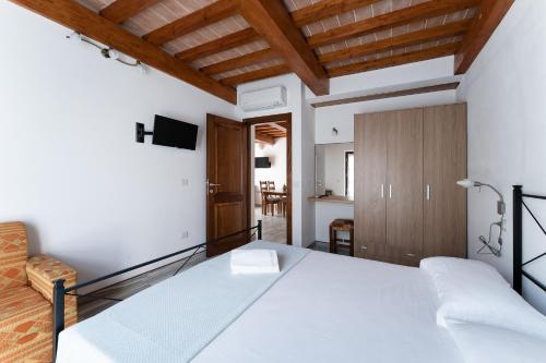 Ένα ή περισσότερα κρεβάτια σε δωμάτιο στο Hotel Delfino