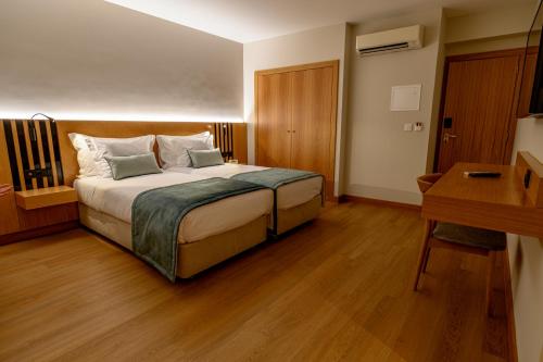 Letto o letti in una camera di Santa Eufémia Covilhã Hotel