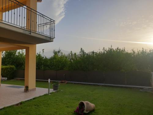 a backyard with a yard with a fence and a yard at B&B Villa Chiara - Bed And Breakfast in Taormina