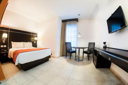 Postel nebo postele na pokoji v ubytování HOTEL OLIBA Boca del Rio