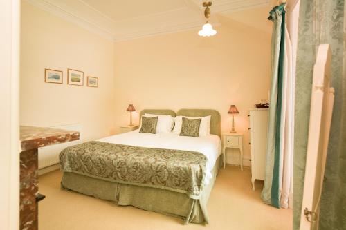 a bedroom with a bed in a room at Springkell in Eaglesfield