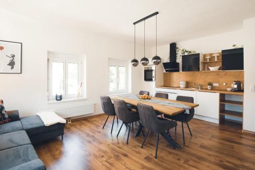 a kitchen and dining room with a table and chairs at Kapuzini Livin‘ in Knittelfeld