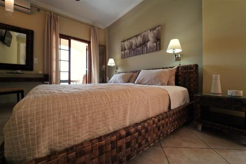 Letto o letti in una camera di Bella Vista Hotel Studios & Apartments