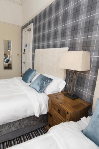 Postel nebo postele na pokoji v ubytování Edinburgh Rays Guest House