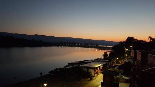 a view of a body of water at sunset at Apartman Plaža Lux in Veliko Gradište