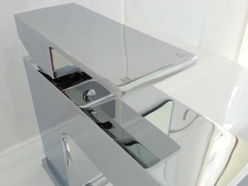 a bathroom with a mirror and a sink at Beaufort Lodge - Central Location & Free Parking in Taunton