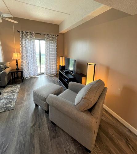 a living room with a couch and a tv at Sugar Top 2805 Condo in Sugar Mountain
