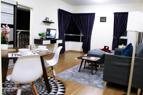 a living room with a couch and a table at MLH Premier Suites @ Saville Cheras in Cheras