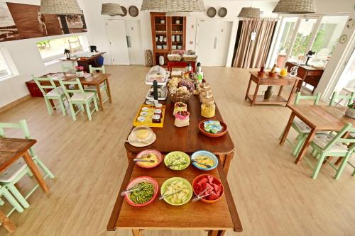 a kitchen filled with lots of different types of food at Sesmarias Turismo Rural & SPA in Peroguarda