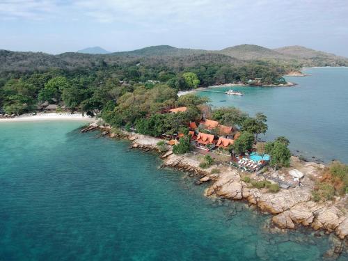 an island with a house in the middle of the water at Vimarn Samed Resort in Ko Samed