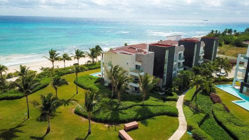 an aerial view of a resort and the ocean at Mareazul Beach Front Condos At playa del Carmen in Playa del Carmen