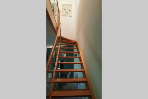 a set of stairs leading up to a room at Superbe Duplex au Nouveau Bassin avec vue superbe in Mulhouse