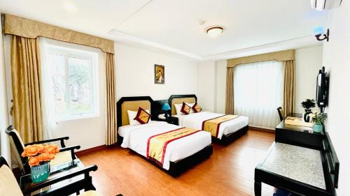 Ένα ή περισσότερα κρεβάτια σε δωμάτιο στο Sea Pearl Cat Ba Hotel