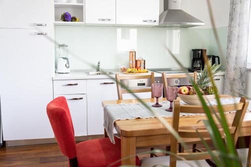 a kitchen with a table and a dining room at Apartment Josipa in Split