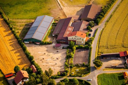 an overhead view of a building with a group of buildings at Pension & Reitschule Fuchsenhof in Seebarn