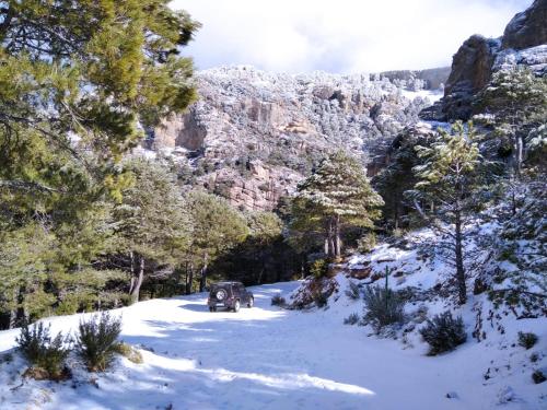 a car driving down a snow covered road at Alojamiento Rural MAGALAN in Pozo Alcón