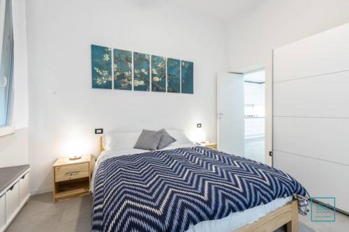 En eller flere senger på et rom på Appartamento incantevole Lido di Ostia- Corallo Azzurro